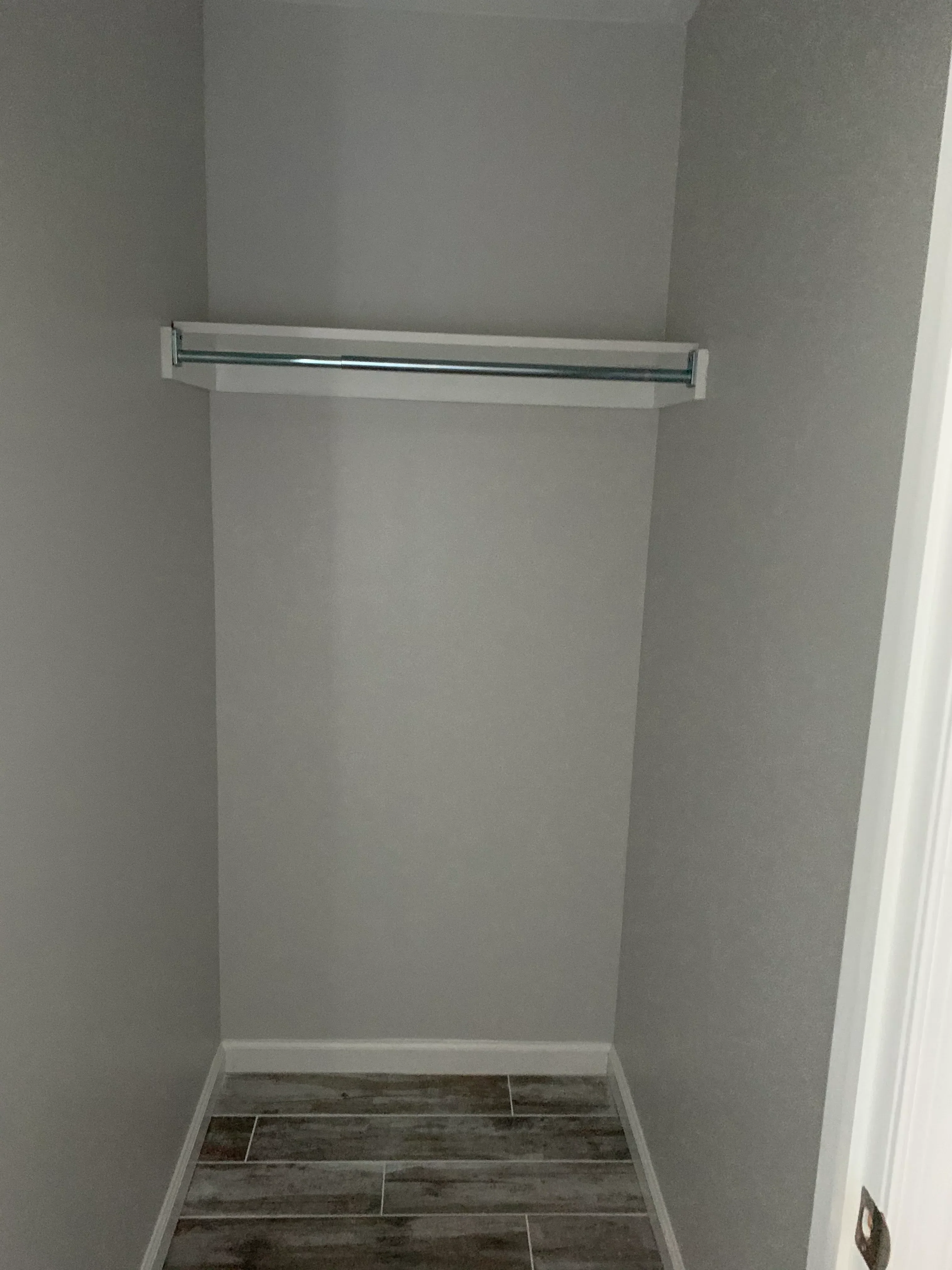 Drywall installation with two-tone paint finish, recessed lighting, and ceiling work