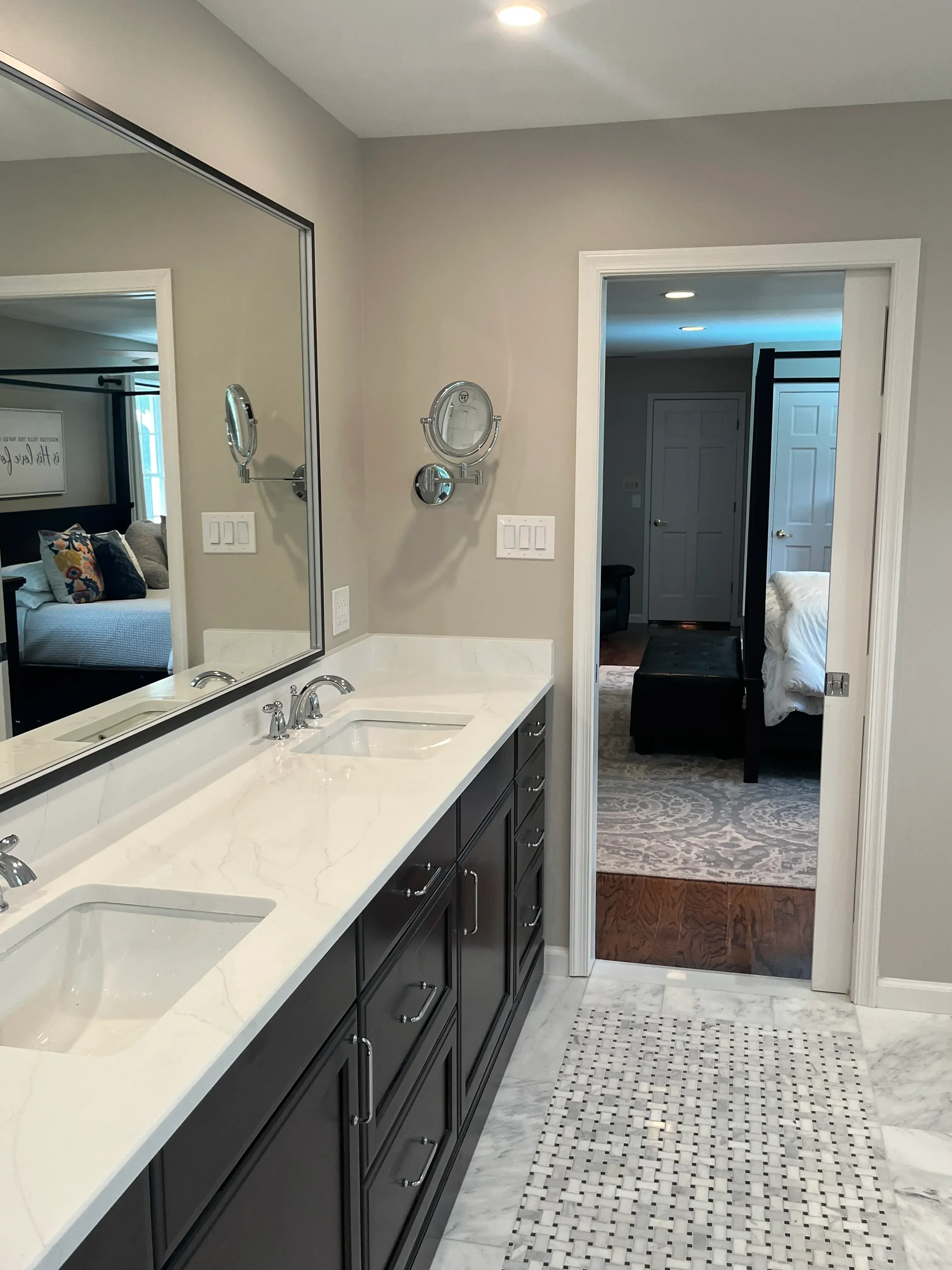 Kitchen remodel with white cabinetry, black cooktop, marble and wood backsplash, chrome fixtures