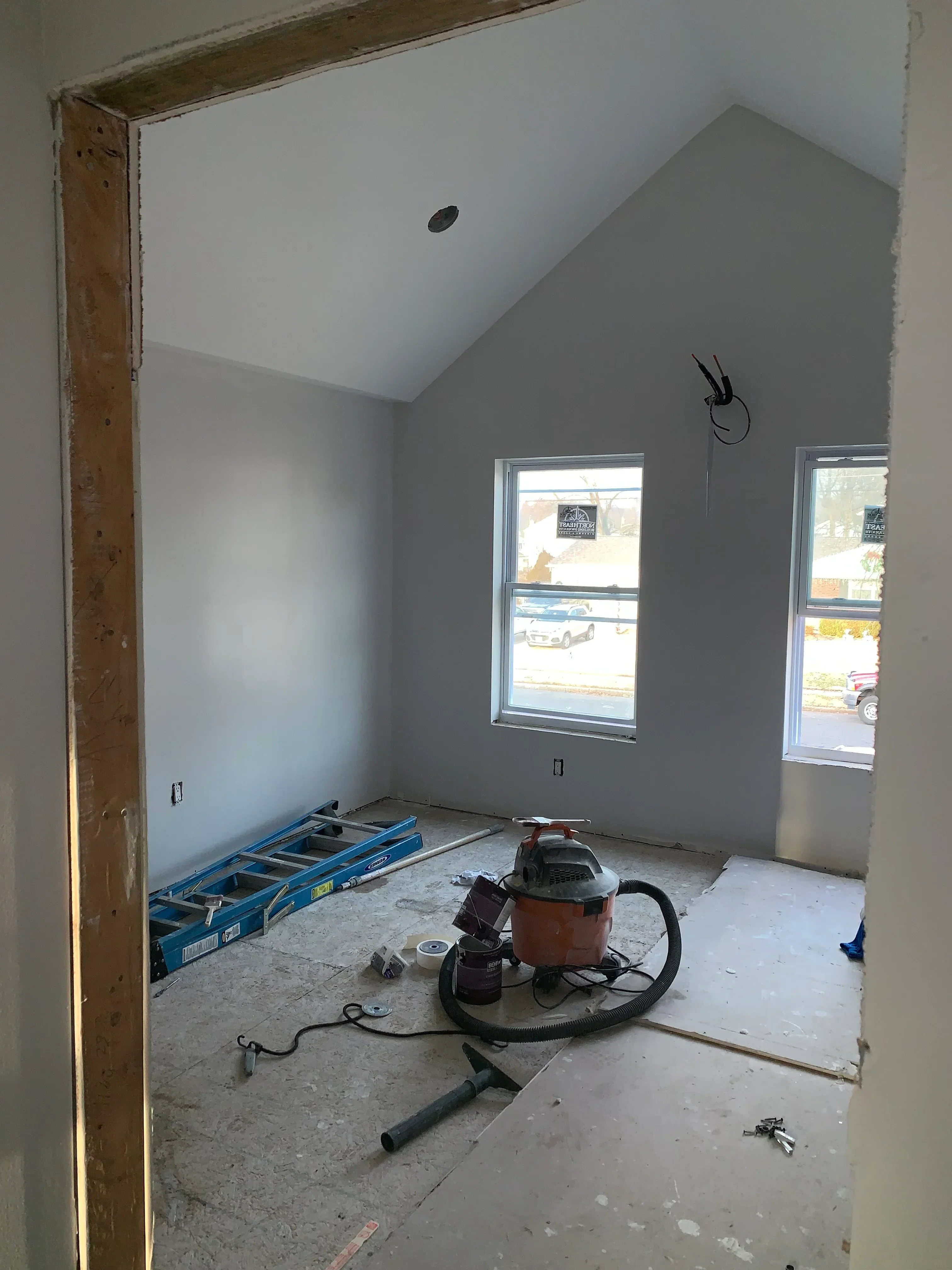 Drywall-finished vaulted ceiling with skylights and electrical rough-in during construction